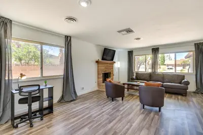 a living room with a couch and a table at Quiet Ridgecrest Vacation Rental with Private Yard! in Ridgecrest