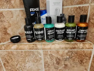 a group of four bottles of hair products on a wall at Hollywood Hills Hideout Apartment! in Los Angeles