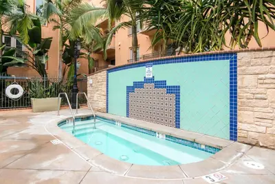 a swimming pool in front of a building with a tile wall at Playa del Rey 1BR w Gym WD Pool nr LAX Beach LAX-147 in Los Angeles
