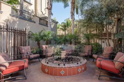 a patio with chairs and a fire pit in front of a building at Playa del Rey 1BR w Gym WD Pool nr LAX Beach LAX-147 in Los Angeles