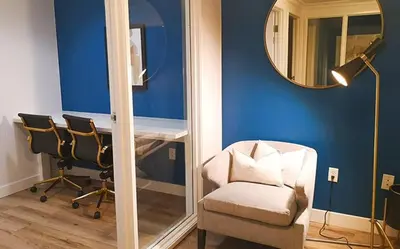 a blue room with a chair and a mirror at Playa del Rey 1BR w Gym WD Pool nr LAX Beach LAX-147 in Los Angeles