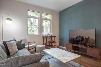 a living room with a couch and a tv at Playa del Rey 1BR w Gym WD Pool nr LAX Beach LAX-147 in Los Angeles