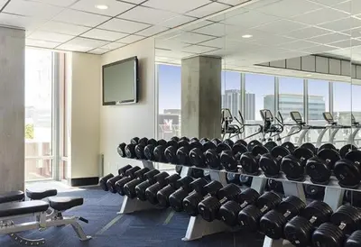 a gym with rows of chairs and a flat screen tv at Luxurious Hollywood Dream in Los Angeles