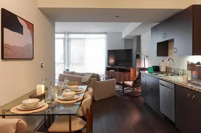a kitchen and a living room with a dining table at Luxurious Hollywood Dream in Los Angeles
