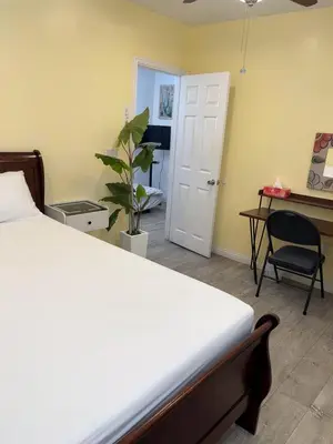 a bedroom with a bed and a desk and a chair at cozy & Quiet Tow Bed & one bath in Rosemead