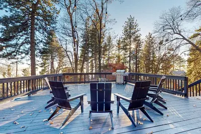 two chairs and a table on a deck at Ferndale woods in Running Springs