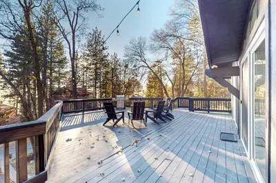 a deck with chairs and a table on a house at Ferndale woods in Running Springs