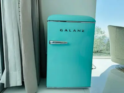 a blue refrigerator sitting next to a window at Exclusive Hillside Hideaway-Private Room in Los Angeles