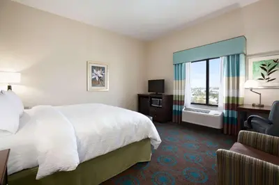 a hotel room with a bed and a window at Hampton Inn Los Angeles Int'l Airport/Hawthorne in Los Angeles