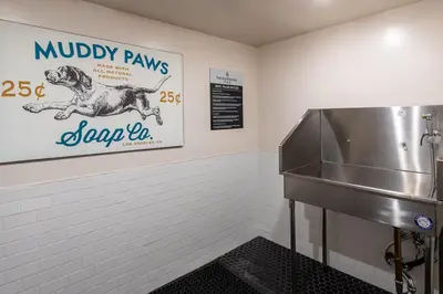 a dog grooming room with a sink and a sign at West LA 1br w rooftop gym nr restaurants LAX-1103 in Los Angeles