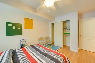 a bedroom with a bed and two chairs in it at Porterville Getaway with Patio and Valley Views! in Porterville