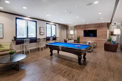 a living room with a pool table in it at Marina Del Rey Apartment Luxury pool, gym, parking, BBQ in Los Angeles
