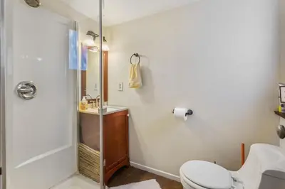 a bathroom with a shower and a toilet and a sink at Private Studio City Guest House in Los Angeles