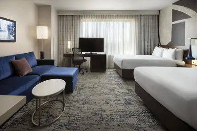 a hotel room with a bed and a couch at Residence Inn by Marriott Los Angeles L.A. LIVE in Los Angeles
