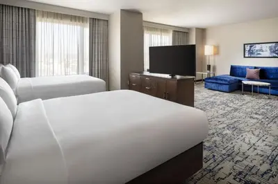 a hotel room with two beds and a flat screen tv at Residence Inn by Marriott Los Angeles L.A. LIVE in Los Angeles