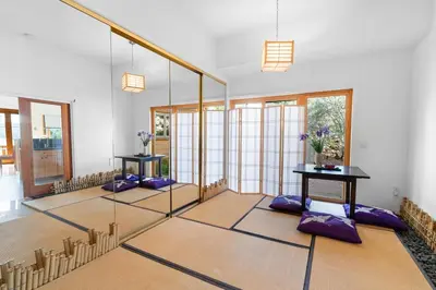 a room with purple meditation mats on the floor at Amazing Grace - Zen mountain retreat with lake views in Fawnskin