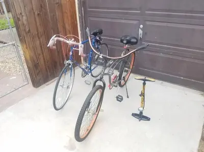 a bike is parked next to a garage at Pool Table A C Grill Out Netflix Bikes Yard in Fullerton