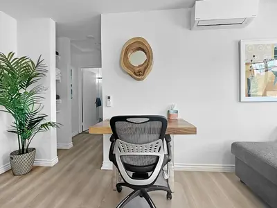 a desk with a chair in a living room at Discount For 30 Days Plus Stay In Culver City in Los Angeles