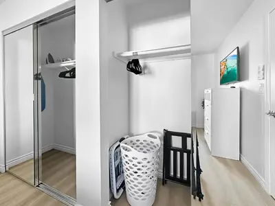 a white room with a refrigerator and a chair at Discount For 30 Days Plus Stay In Culver City in Los Angeles