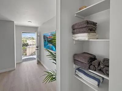 a room with a hallway with towels on shelves at Discount For 30 Days Plus Stay In Culver City in Los Angeles