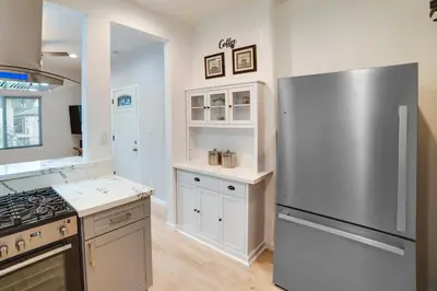 a kitchen with a large stainless steel refrigerator at Pet-Friendly Riverside Vacation Rental with Patio! in Riverside
