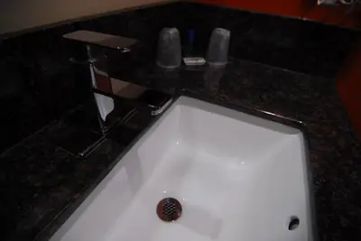 a white sink with a faucet on a counter at Studio City Inn - Near Universal Studios Hollywood in Los Angeles