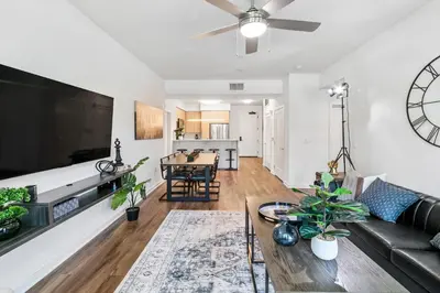 a living room with a couch and a table at Beverly Grove Chic City Oasis 2 BR Apt with Den 138 in Los Angeles