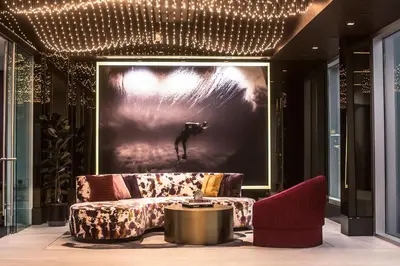 a living room with a couch and a picture of a dog at Beverly Grove Chic City Oasis 2 BR Apt with Den 138 in Los Angeles