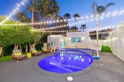a swimming pool with lights and chairs and a building at Universal Studios Villa with Pool & Guesthouse in Los Angeles