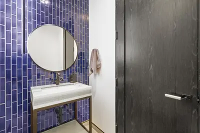 a bathroom with a sink and a mirror at NEW Luxury Concrete Home Just Minutes from the Beach in Long Beach