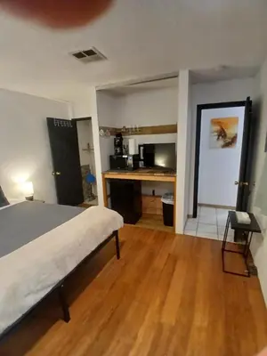 a bedroom with a bed and a wooden floor at Lakefront Escape in Big Bear Lake