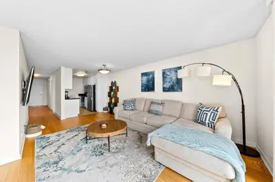 a living room with a couch and a table at Smoky Quartz -Marina View Spacious 3BR near Yacht Club in Los Angeles