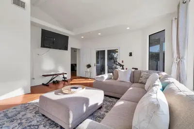 a living room with a couch and a table at Oaks Garden in Thousand Oaks