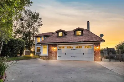 a house with a garage in front of it at Oaks Garden in Thousand Oaks