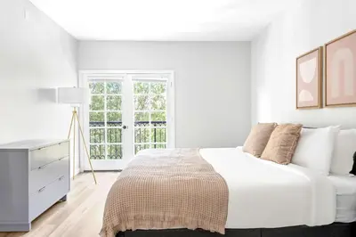 a white bedroom with a bed and a desk at Westwood 2BR nr Westwood Village LAX-902 in Los Angeles