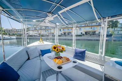 a boat with a table on the water at Garnet Glow Full Ocean and Venice Beach view 3BR in Los Angeles