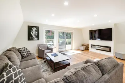 a living room with a couch and a table at Modern Pine Mountain Club Cabin with Community Pool! in Pine Mountain Club