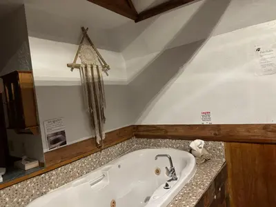 a bathroom with a bath tub in a room at The Village Cabins in Big Bear Lake