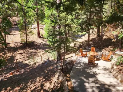 an overhead view of a patio with chairs and a table at The Ponderosa in Running Springs