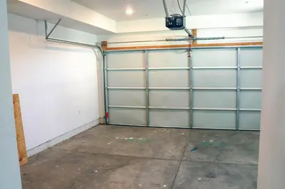 a garage with glass doors and a concrete floor at 4BR/4BR modern house at Mid-city in Los Angeles