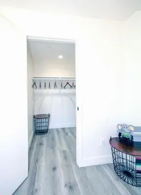 a room with white walls and a hardwood floor at Stylish 3 BR/3BR family house in Los Angeles