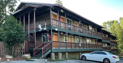 a white car parked in front of a building at Deep Creek in Arrowbear Lake