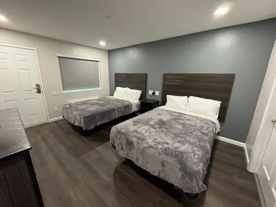 a hotel room with two beds and a window at Deep Creek in Arrowbear Lake