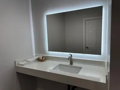 a bathroom with a sink and a large mirror at Deep Creek in Arrowbear Lake