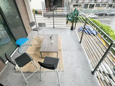 three chairs and a table on a balcony at Cozy Chamber 3 BR Hollywood Townhouse in Los Angeles