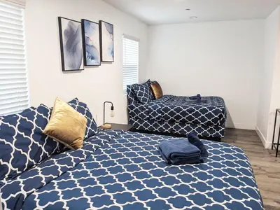 a bedroom with a bed and a couch at Wonderful 3 Bedroom Home Perfect for Getaway in Los Angeles