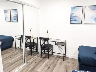 a room with two chairs and a table with a mirror at Wonderful 3 Bedroom Home Perfect for Getaway in Los Angeles