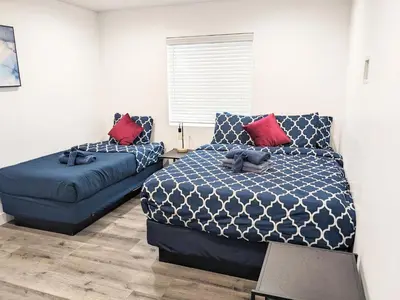 a bedroom with a bed and a couch at Wonderful 3 Bedroom Home Perfect for Getaway in Los Angeles