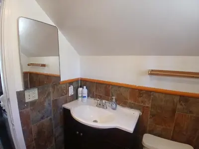 a bathroom with a sink and a toilet at Boulder Bay Cottages in Big Bear Lake