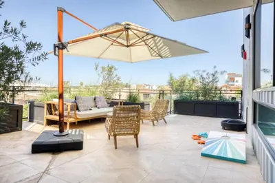 a patio with a table and an umbrella at Culver City 1br w rooftop lounge access to 405 LAX-1124 in Los Angeles